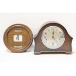 A1930's oak cased mantel clock, together with a mahogany cased wall calendar