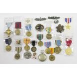 Thirteen US medals, including Airforce, Legion of Honour and eight badges and a compass