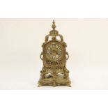 A pierced brass mantel clock