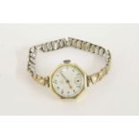 A ladies 18ct gold Omega mechanical octagonal watch, with white enamel dial, Arabic numerals and