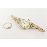 A ladies 9ct gold mechanical bracelet watch, white enamel dial with Roman numerals, a gold four