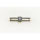 A Victorian gold memorial black enamelled two row bar brooch, with central forget-me-knot panel