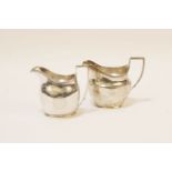 A George III silver cream jug, reeded rim, and chased and engraved decoration, marks for London,