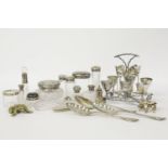 A collection of silver mounted dressing table items, an egg cruet