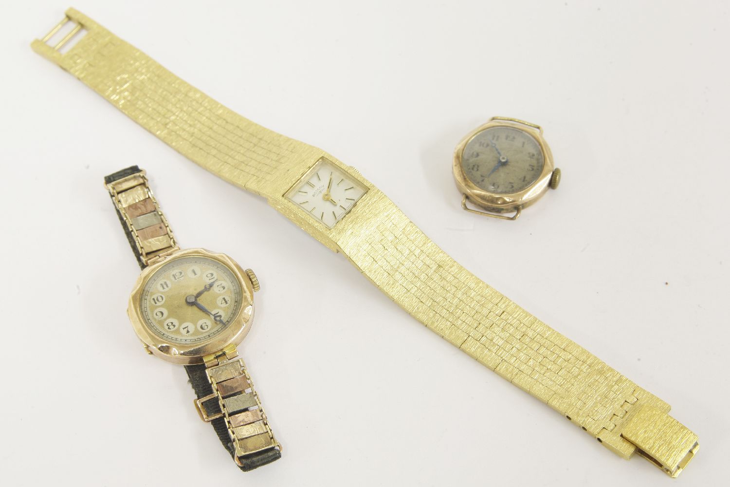 A 9ct gold ladies mechanical watch, with 9ct gold gold links and moire band, together with a 9ct