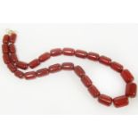 A single row graduated cherry coloured Bakelite barrel bead necklace39.74g