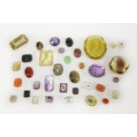 A collection of gemstones and paste stones to include two mixed cut citrines, two amethysts, a