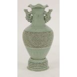 A very large Japanese or Korean vase, with two animal handles, the body with openwork basket design,