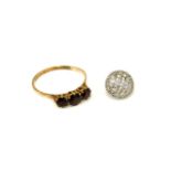 A gold three stone garnet ring, and a 9ct gold diamond earring, garnet ring 1.97g, earring 1.29g