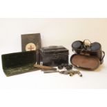 A pair of Hans Weiss binoculars, a cased set of mathematical instruments, lighters, police whistles