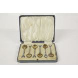 A set of George VI silver and enamel teaspoons, Birmingham 1937, cast and enamelled with