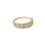 A white gold two row diamond half eternity ring, tested as approximately 18ct gold.6.97g