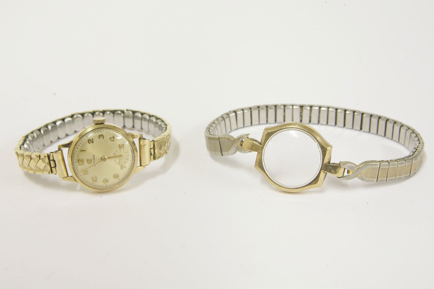 A ladies 9ct gold Cyma mechanical watch, with Arabic numerals and later expanding bracelet, and a