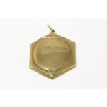 An early 20th century 9ct gold hexagonal compact with hinged lid, opening to reveal a powder