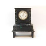 A 19th century black slate marble mantel clock, with a white enamel dial and Roman