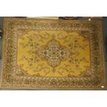 An Axminster rug, mustard ground decorated with stylised foliate boarder, 360 x 270 cm approx