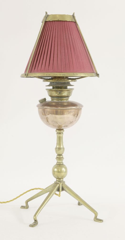 A brass and copper oil lamp, designed by W A S Benson, converted to electricity, 62cm high