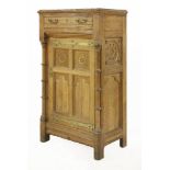 An oak and walnut cabinet,designed by Bruce Talbot (1838-1881) for Gillows of Lancaster, with a
