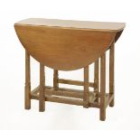 A walnut gateleg table,designed by Ernest Gimson (1864-1919),81cm wide95cm open68.5cm highAn