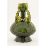 An Ault pottery 'Tongues' vase,designed by Dr Christopher Dresser in a green glaze, the four handles