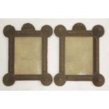 A pair of chip carved mirror frames, with rectangular plates and raised circular details to the