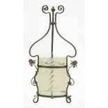 An Arts & Crafts wrought iron and vaseline glass hall lantern,with copper flower head terminals
