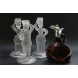Three Baccarat moulded glass candlesticks, 24.5cm high, and a wine/claret bottle