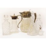 A large cut glass jug, a claret jug, three decanters and a scent bottle