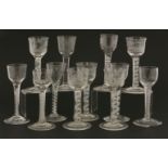 Twelve air twist wine glasses, 18th century and later, five with bowls etched with Eastern scenes on