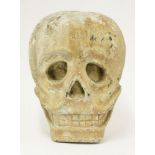 A painted wood skull,c.1900, grinning maniacally,29cm high