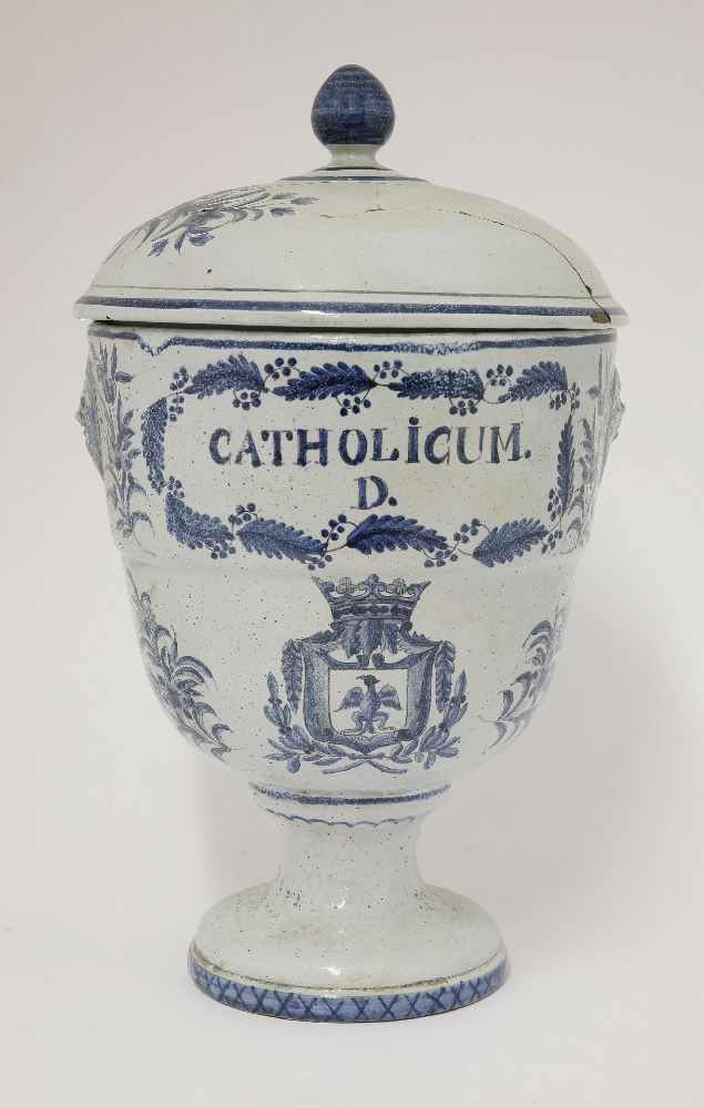 A Continental faience jar and cover,labelled 'Catholicum', cover restored, 36cm high