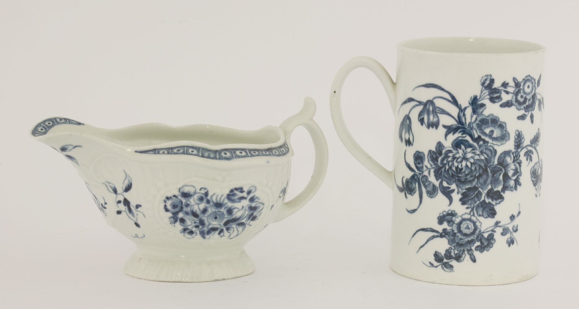 A Worcester blue and white sauce boat,c.1780, painted with a floral pattern on a moulded strap flute - Image 2 of 3