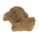 A terracotta fragment of Christ,probably 19th century,16cm wide