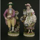 A pair of Minton figures of a gardener and his female companion,the young man dressed in yellow