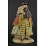 A Cozzi Italian porcelain figure,19th century, of a masked bearded man wearing a tricorn hat, with a