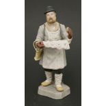 A Russian biscuit porcelain figure,19th century, of a bagel seller, stamped Gardner factory,21cm