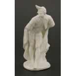 A Komodie white porcelain figure,of Pantalone leaning forward on a shaped circular base, with