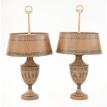 A pair of Etruscan-style toleware table lamps,of urn form, decorated with black figures against a