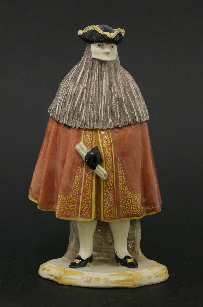 A Cozzi Italian porcelain figure of masked bearded man,19th century, wearing a tricorn hat, red