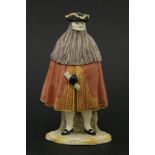 A Cozzi Italian porcelain figure of masked bearded man,19th century, wearing a tricorn hat, red