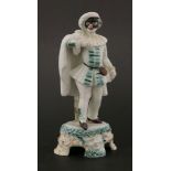 A Cozzi Italian masked figure of Pierrot,19th century, mounted on circular base, applied with