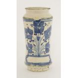 An albarello vase,late 17th century, with blue flower panel over a vacant cartouche, chips,24.5cm