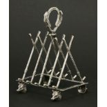 A novelty hunting toast rack,by W W Harrison & Co., Sheffield, 1902, the five divisions modelled