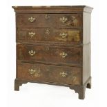 A walnut and feather banded chest of drawers,in two parts, labelled 'Elizabeth Bell & Son at the