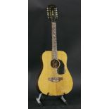 An early 1970s Gibson JG12 acoustic guitar,serial no. 674650, the dreadnought-shaped body in a