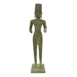 An Eastern bronze standing figure, 19th century, of archaic style, possibly Khmer or Thai, of a
