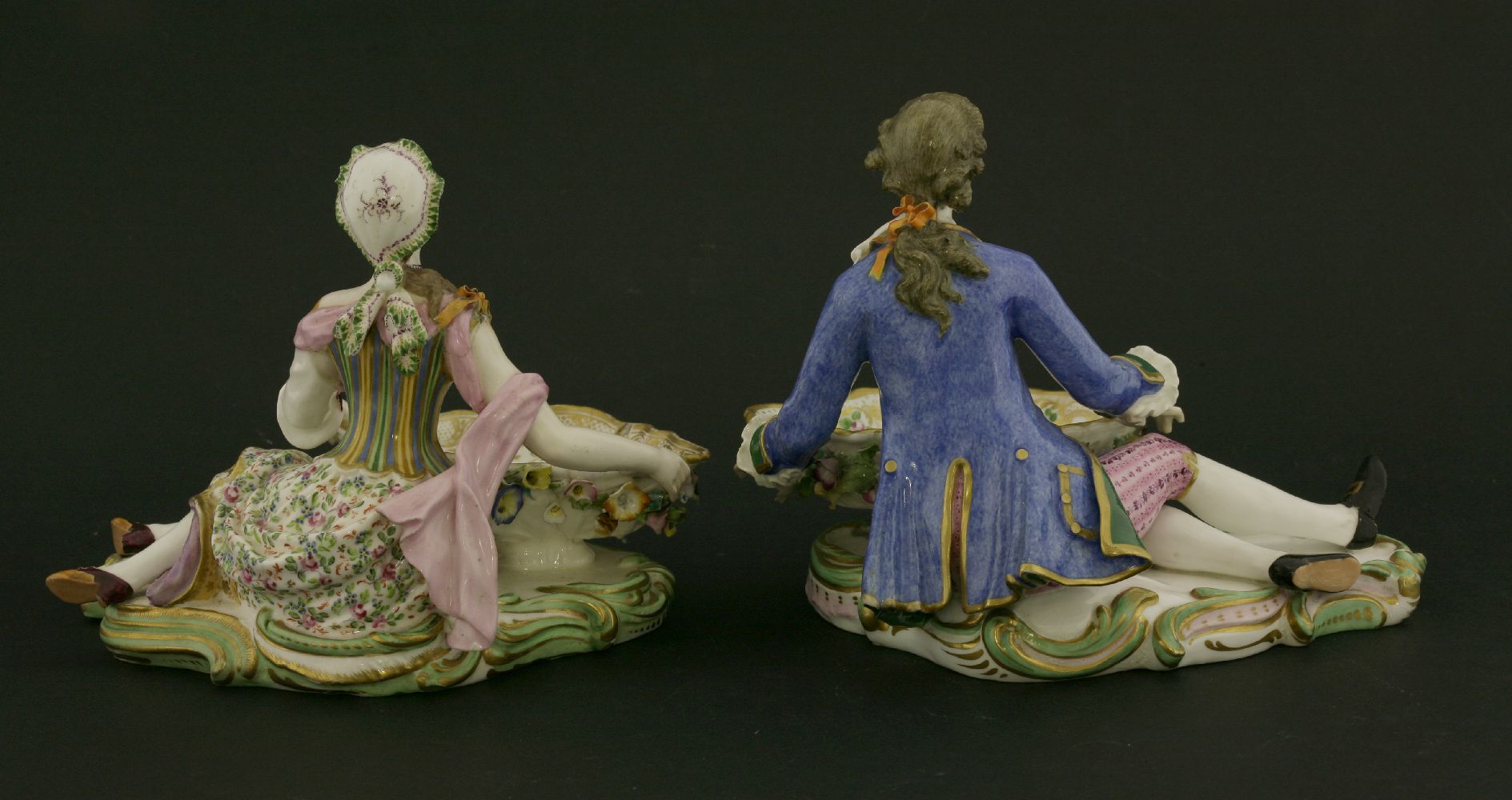 A pair of Minton reclining figures,both cradling a flower-encrusted bowl, on shaped rocaille - Image 2 of 3