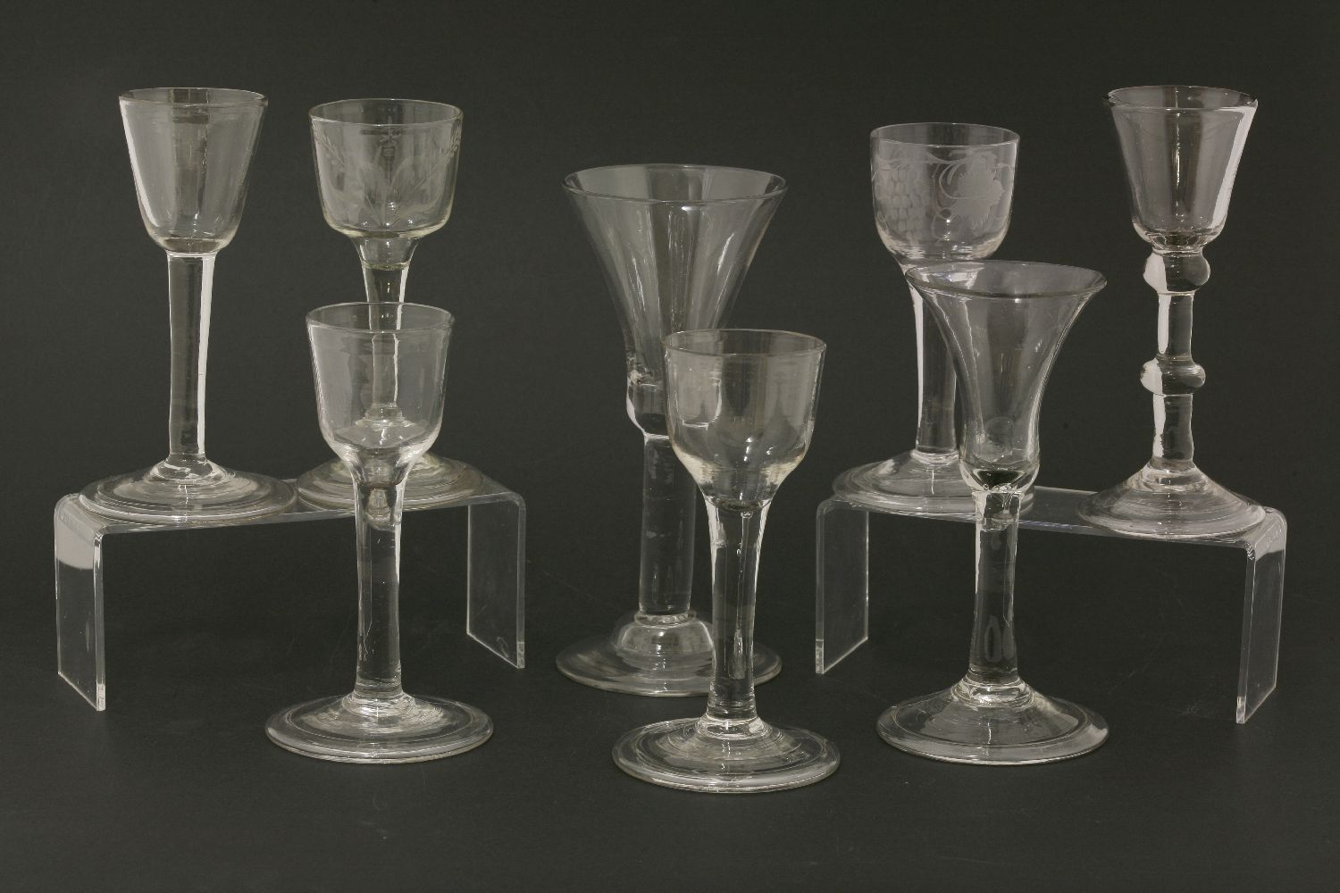 Eight wine glasses,18th century and later, including bell bowl on folded foot, double knopped