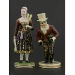 A pair of Derby figures,one of a John Liston as Paul Pry wearing a top hat and carrying an umbrella,