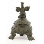 An Italian bronze inkwell,probably 16th century, cast as a vessel with a lion's mask on paw feet and